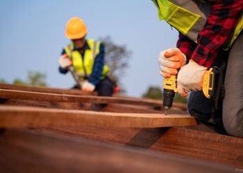 Construction safety professionals conducting site inspection for COR certification audit