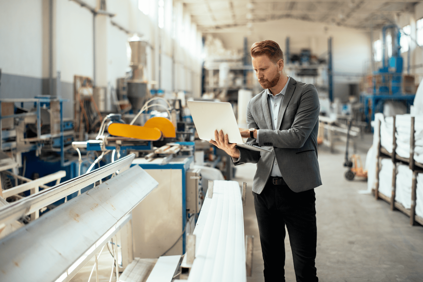 HSE auditor conducting safety program assessment in industrial manufacturing facility