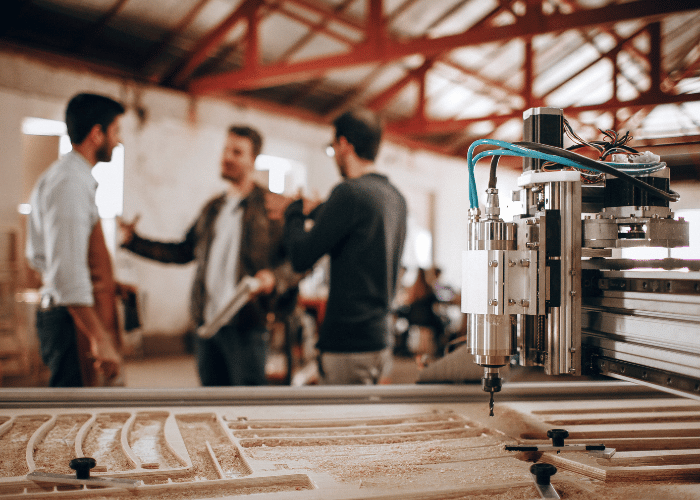 Manufacturing facility interior with industrial equipment and safety protocols in place